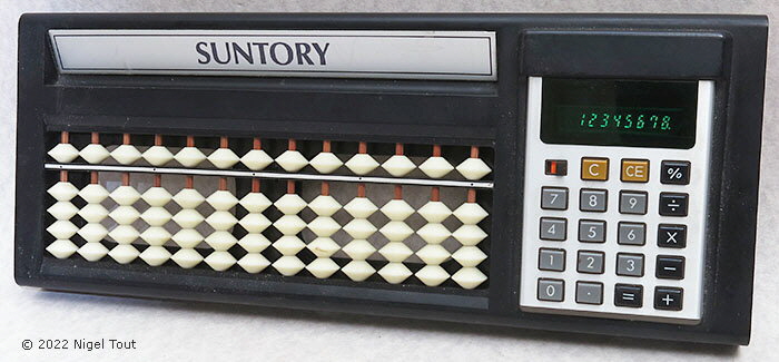 Suntory electronic and soroban calculator 