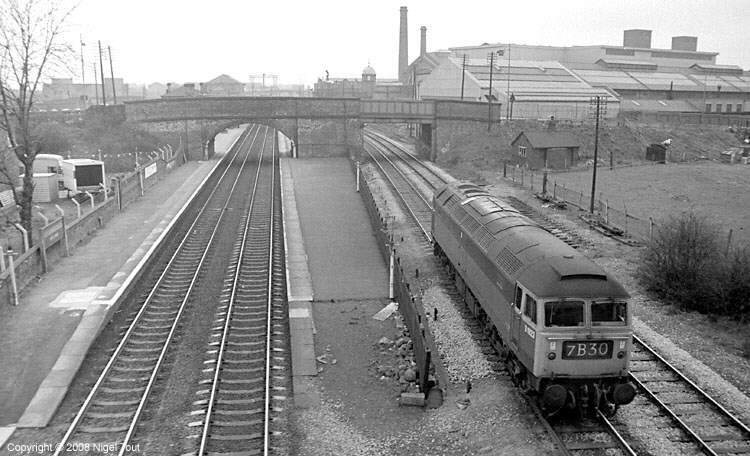 Brush type 4 (class 47) passing Loughborough Midland, from GCR bridge Brush type 4 (class 47) passing Loughborough Midland, from GCR bridge
