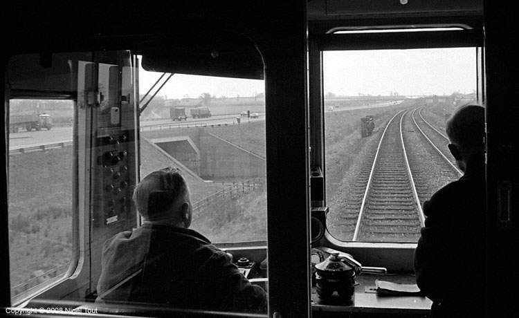 Train on ex-GCR alongside M1 motorway, north of Ashby Magna Train on ex-GCR alongside M1 motorway, north of Ashby Magna